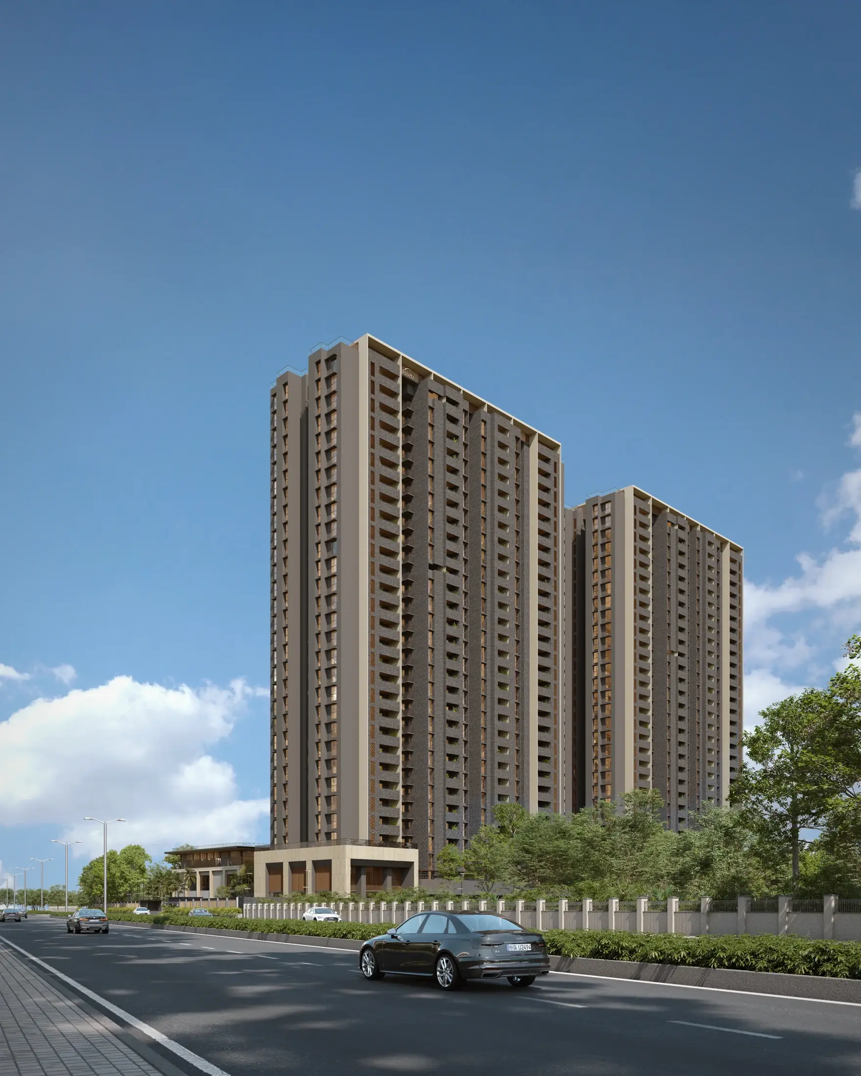The towers of Codename Summit in daylight, seen from the tree-lined road outside the gate.