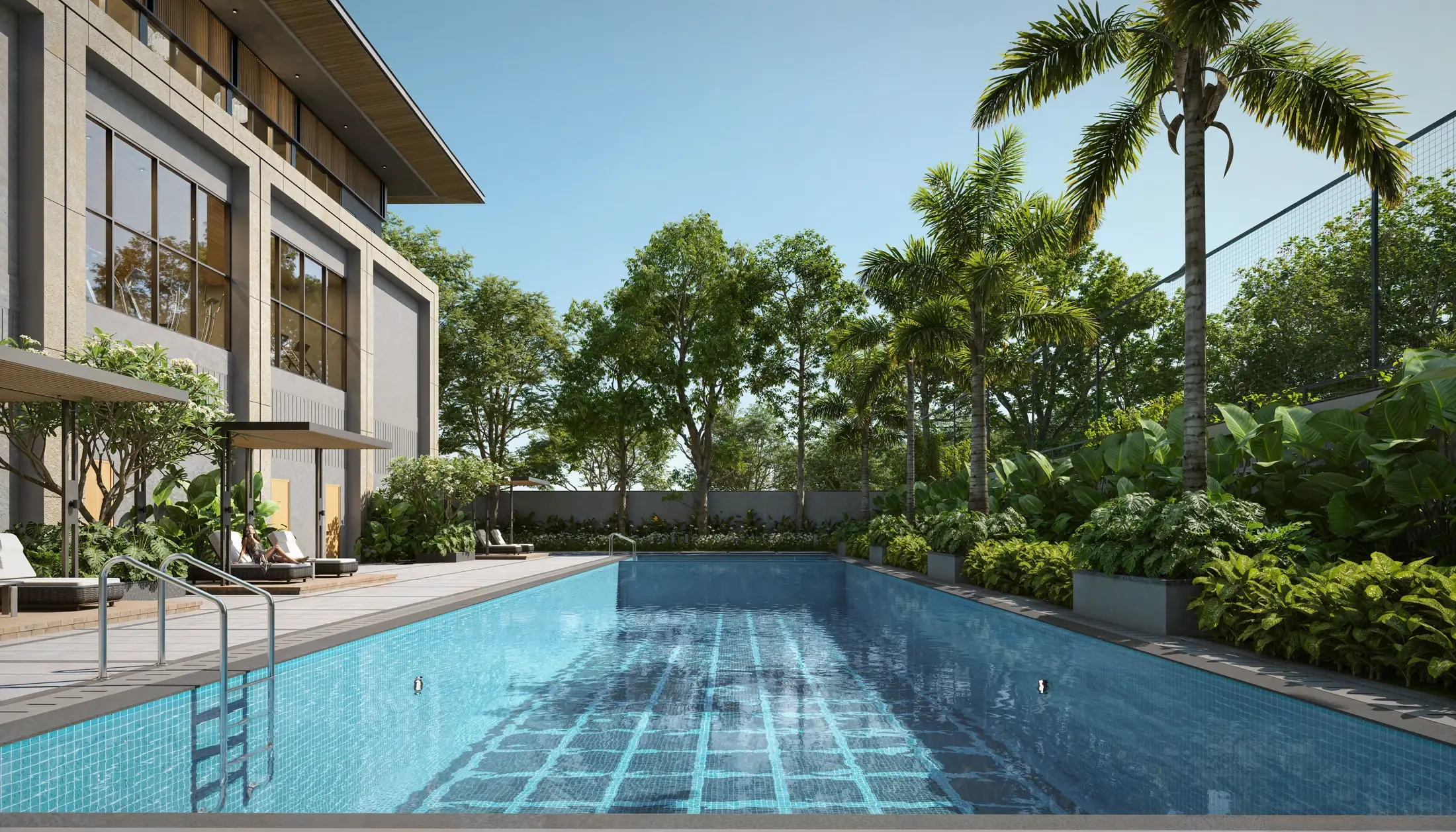 A swimming pool lined with loungers beside the clubhouse, palms behind.